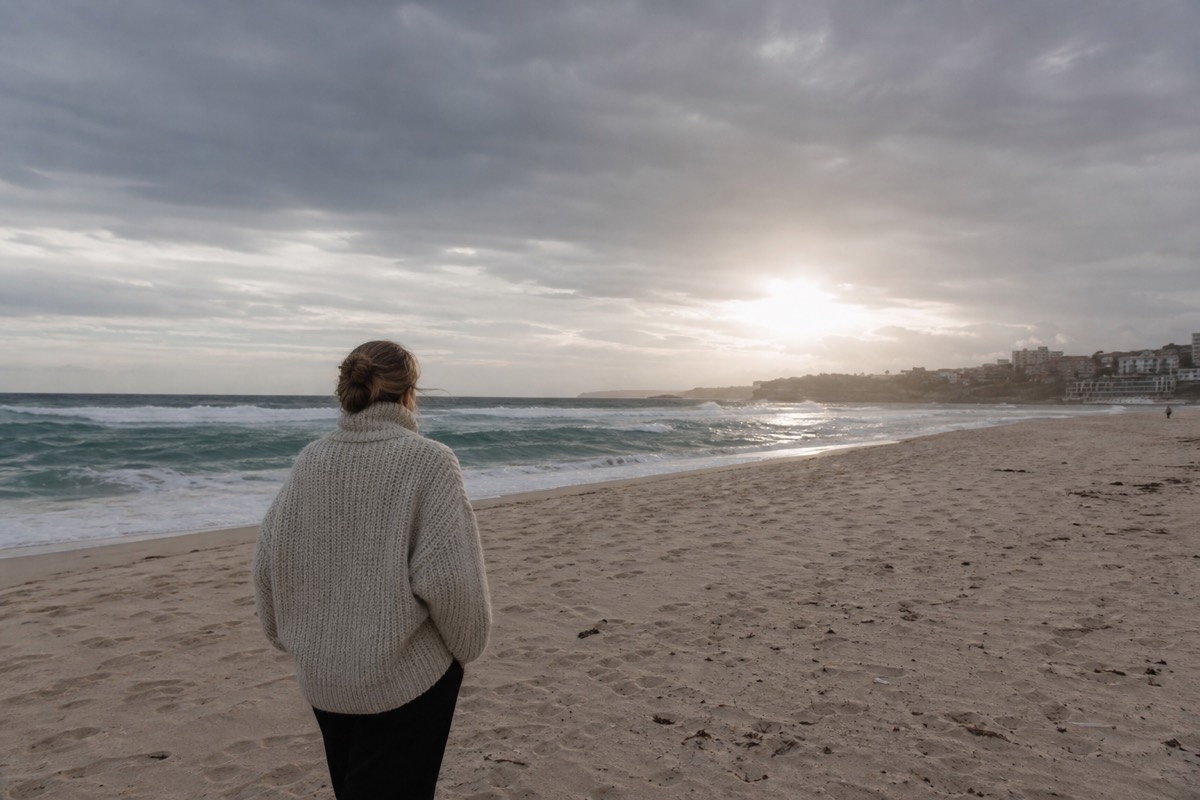 A winter beach in Sydney under grey clouds